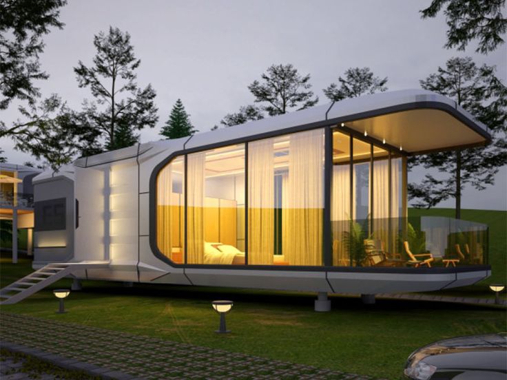 Modern black prefabricated luxury capsule cabins and modular glamping pods installed on a snowy pine-covered mountain slope in Manali, Himachal Pradesh.